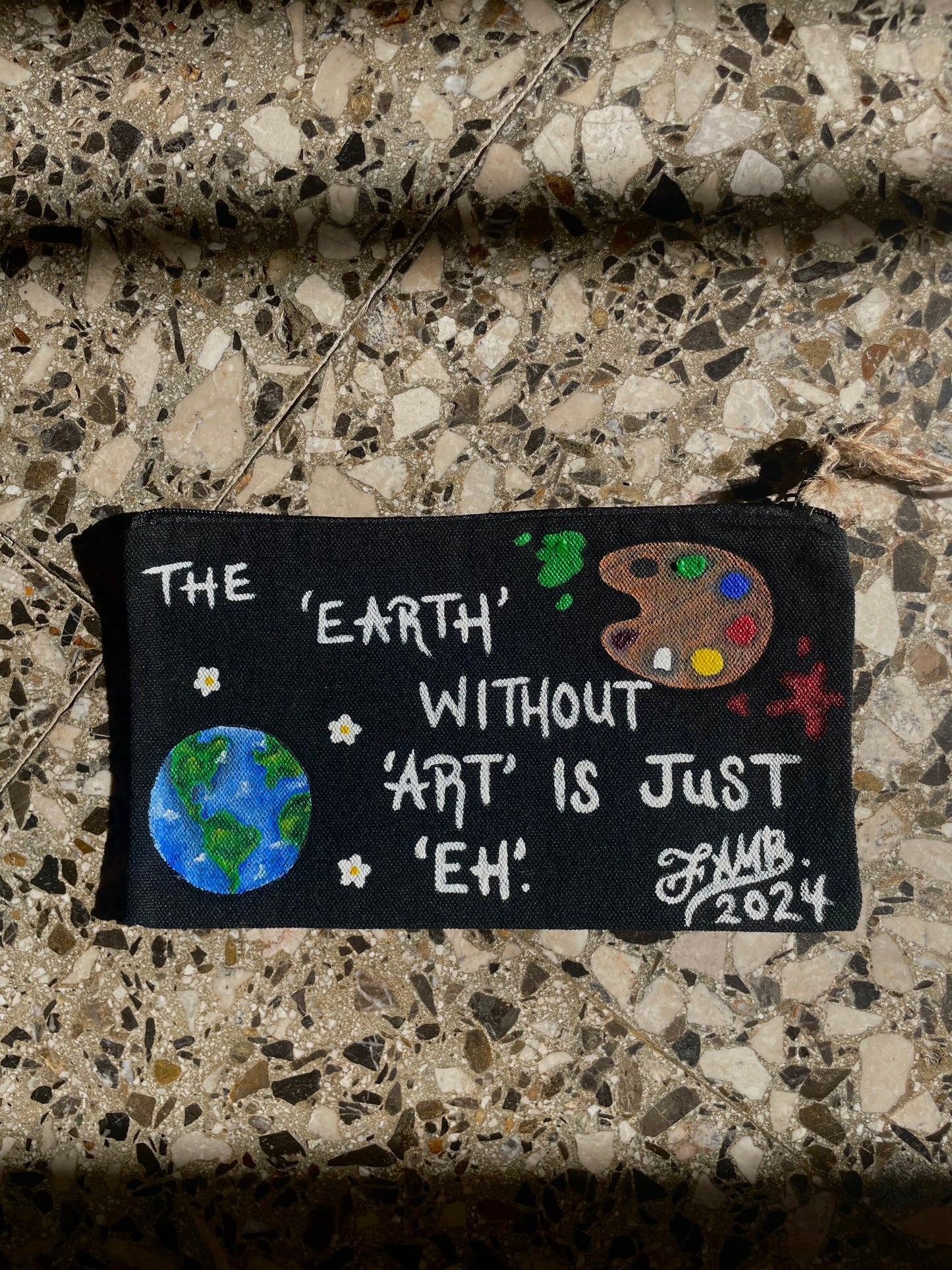 “The ‘Earth’ without ‘art’ is just ‘eh’” painted bag