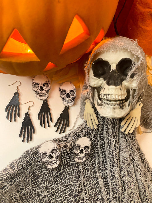 Skeleton hands with skull earrings