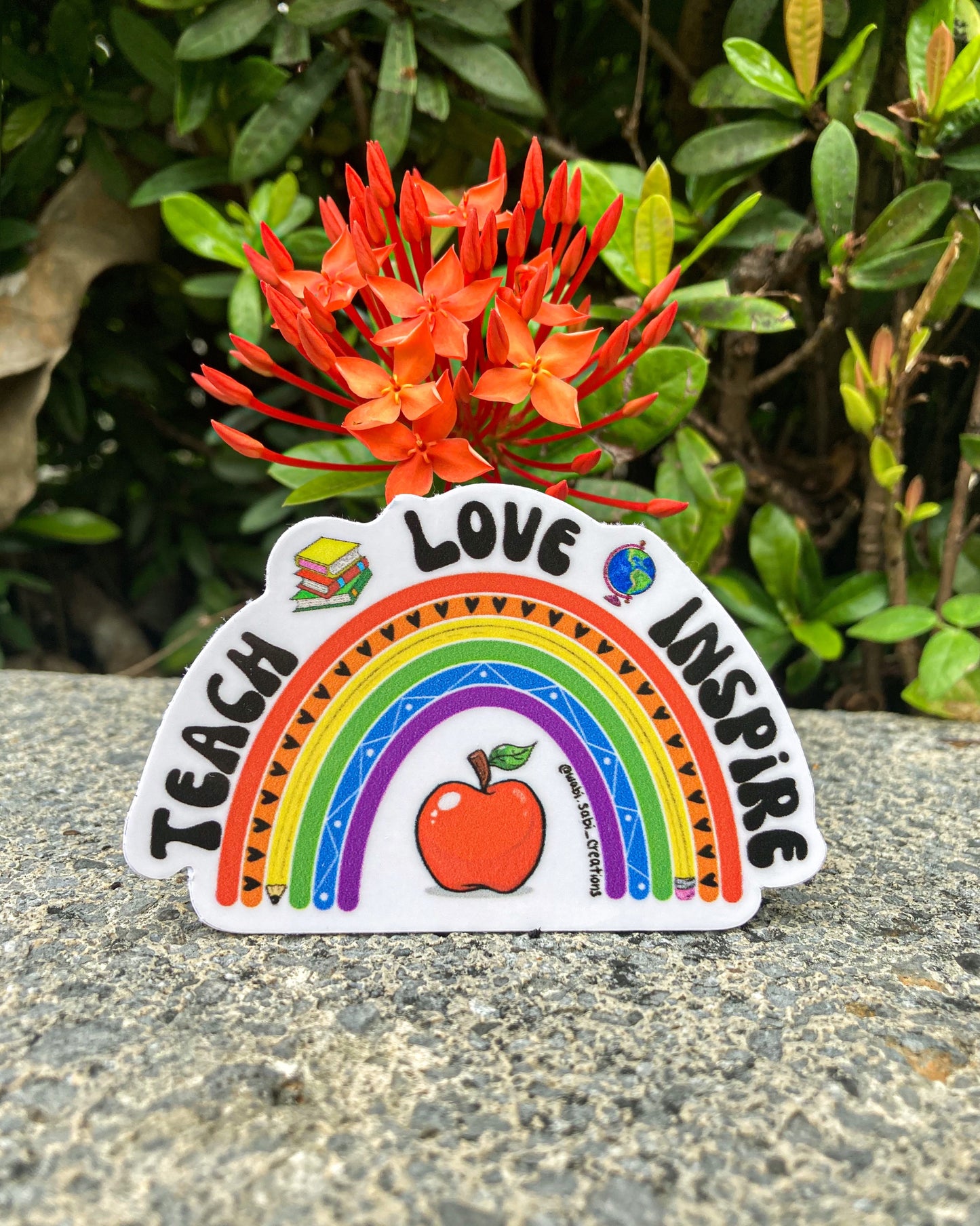 “Teach Love Inspire” sticker
